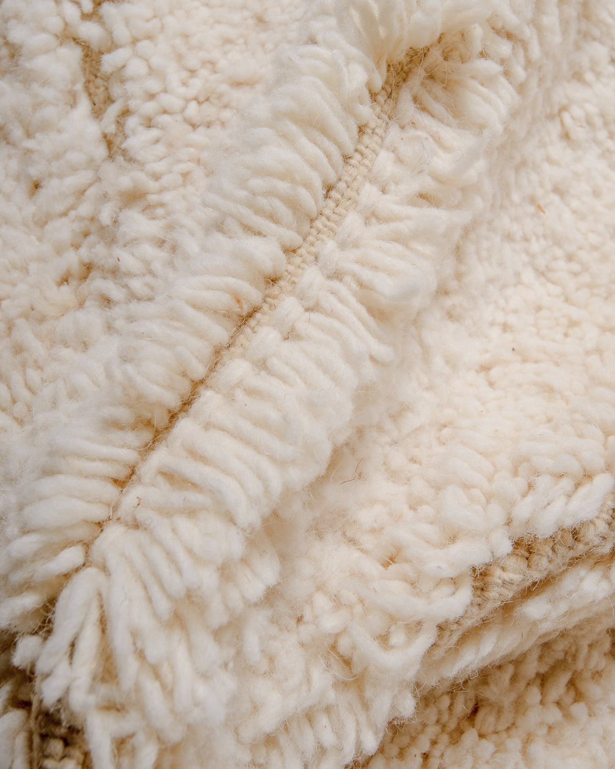 Modern, designer, handcrafted Berber rug from Morocco. Beniourain carpet with minimalist design, natural wool pile and a fluffy texture.